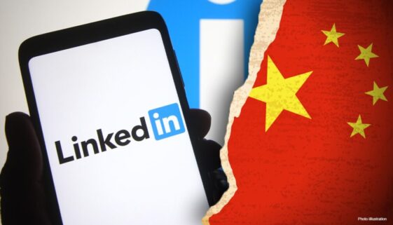 Phone with Linkedin logo next torn half of Chinese flag